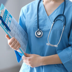 A nurse holding a clipboard