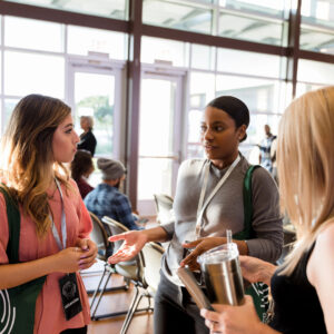 Three people talking in a group