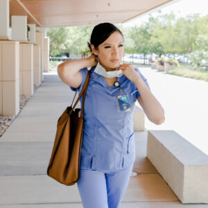 A nurse walks outside