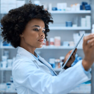 A pharmacist looking at medication stocks