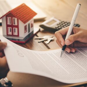 A person signing a mortgage document