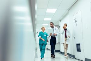 float pool nurse walking and talking with other facility staff