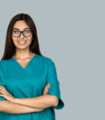 nurse on a travel nurse assignment smiling with arms crossed