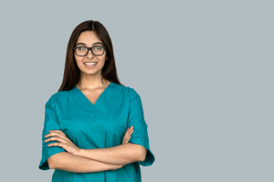 nurse on a travel nurse assignment smiling with arms crossed